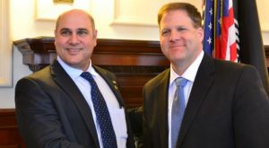 GOA's Alan Rice and NH Governor Chris Sununu shake hands